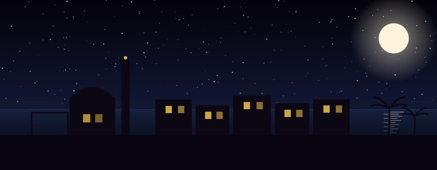 Houses, a place of worship and a football goal silhouetted against a moonlit sea